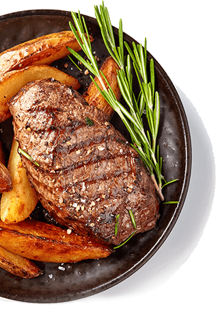 Grilled steak and potato wedges with rosemary.